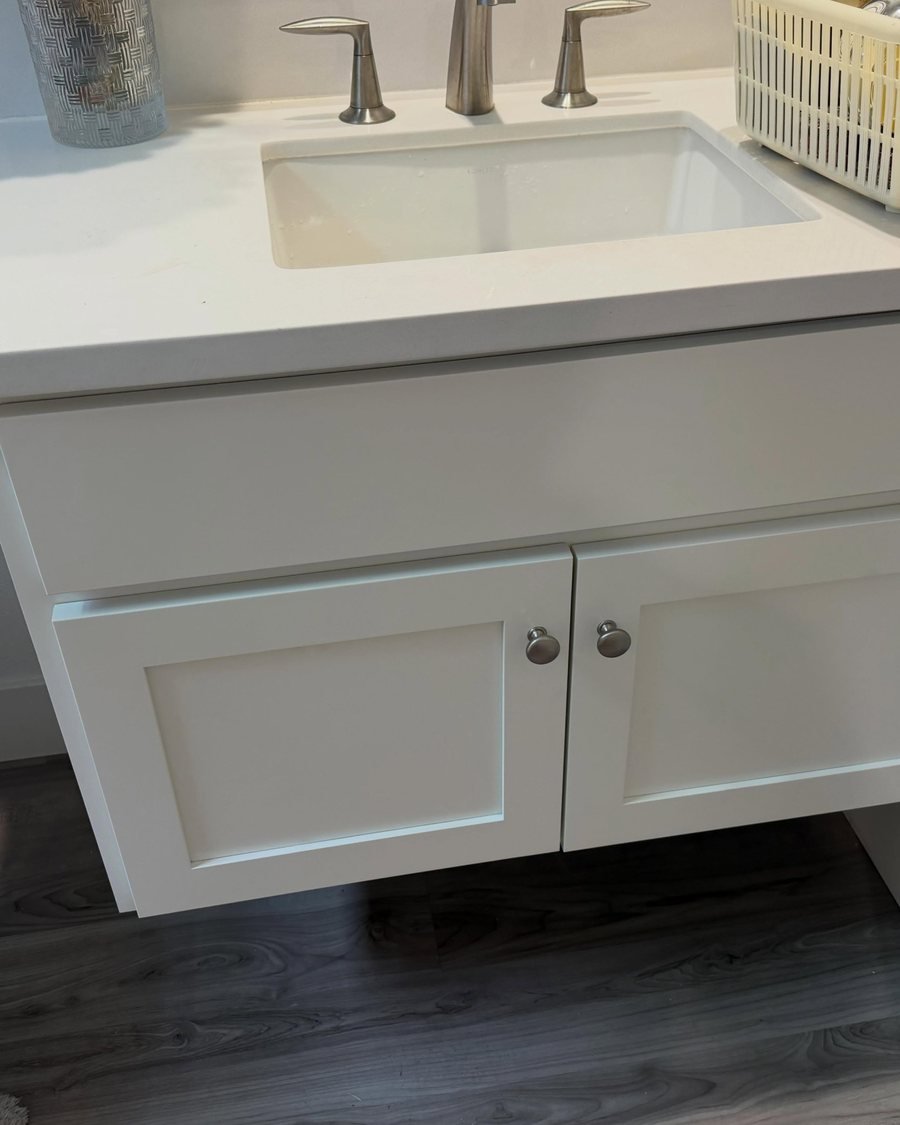 After: the same floating vanity painted white
