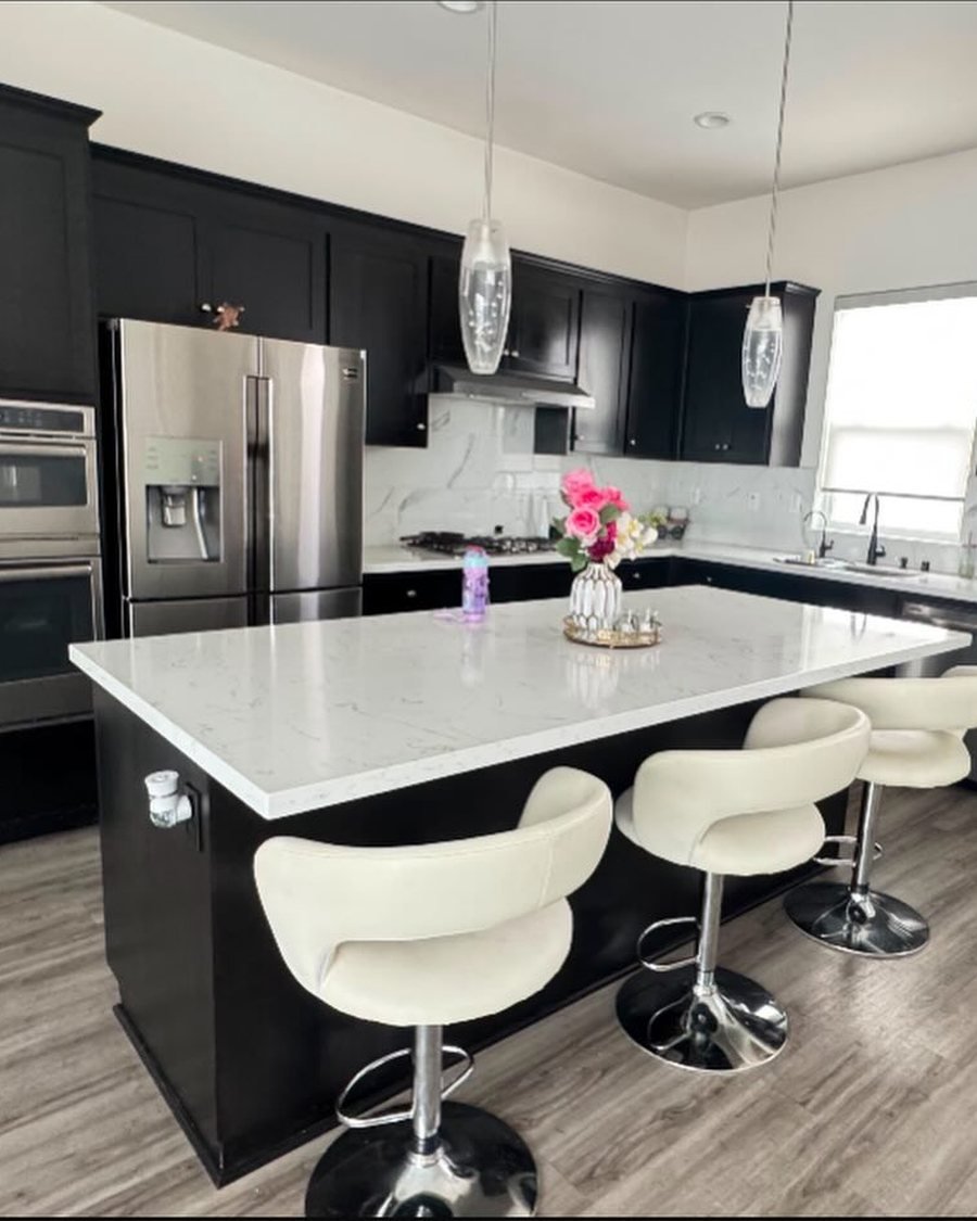 Before: kitchen with dark espresso cabinets, a matching island and white countertops