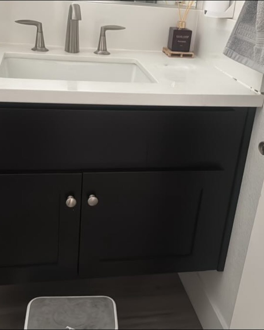 Before: floating bathroom vanity in dark espresso with a white top